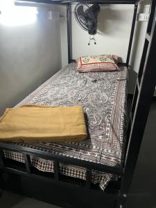 Postel nebo postele na pokoji v ubytování Siya dormitory + 1 fotografie
