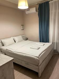 Postel nebo postele na pokoji v ubytování Hotel Tasty Tbilisi + 28 fotografií