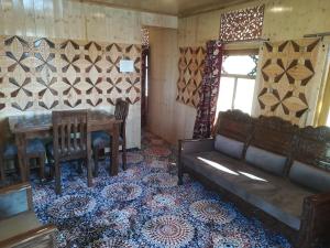 a living room with a couch and a table at House boat house of common in Sudarbal +19 photos