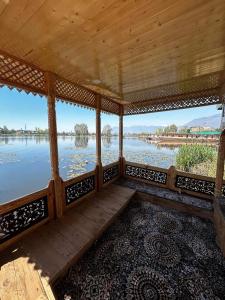 a porch with a view of a river at House boat house of common in Sudarbal