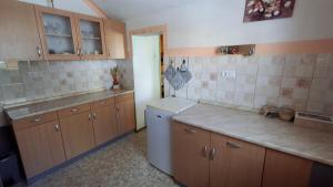 Kuchyň nebo kuchyňský kout v ubytování Apartma Arh