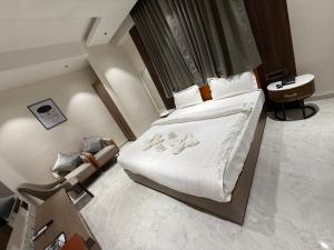Hotel Aishwarya客房内的一张或多张床位