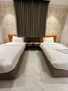 Hotel Aishwarya客房内的一张或多张床位