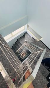 a view from the top of a glass floor at Diya Apartment in Rishīkesh