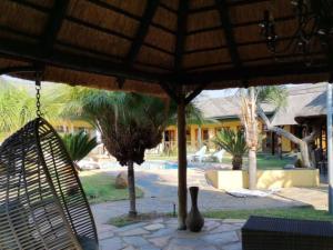 a view of a resort with a pool and an umbrella at Rooiberg Resort & Events Venue in Rooiberg