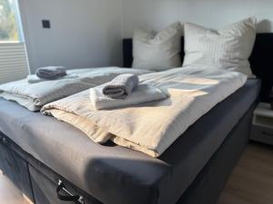 Postel nebo postele na pokoji v ubytování Tiny Hotel in Hollenstedt