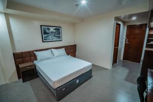 Postel nebo postele na pokoji v ubytování Hotel Monicon