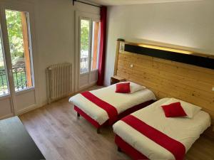 Postel nebo postele na pokoji v ubytování Aparthotel Le Petit Train + 18 fotografií