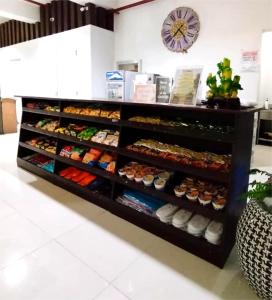 a display case with many different types of food at Sulit Hotel Manila in Manila +24 photos