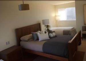 a bedroom with two beds and a window at Seaside Sanctuary in Aspendale