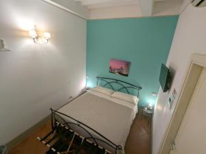 Postel nebo postele na pokoji v ubytování BonConvento Guesthouse - HiTuscany