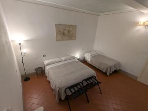 Postel nebo postele na pokoji v ubytování BonConvento Guesthouse - HiTuscany