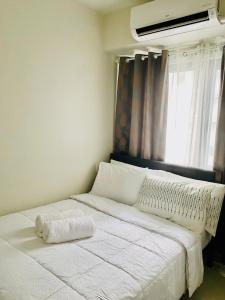 Postel nebo postele na pokoji v ubytování SMDC Shore 3 Residences