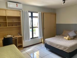 En eller flere senge i et værelse på Studio completo a 200m do shopping Iguatemi