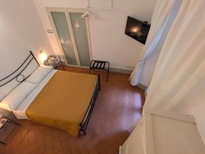Postel nebo postele na pokoji v ubytování BonConvento Guesthouse - HiTuscany