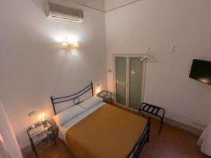 Postel nebo postele na pokoji v ubytování BonConvento Guesthouse - HiTuscany