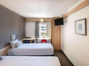 Postel nebo postele na pokoji v ubytování ibis Newcastle