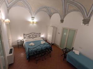 Postel nebo postele na pokoji v ubytování BonConvento Guesthouse - HiTuscany