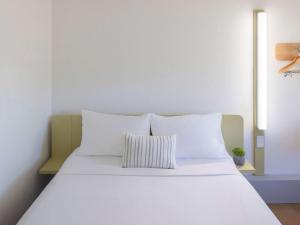 Postel nebo postele na pokoji v ubytování ibis Budget - Newcastle