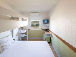 Postel nebo postele na pokoji v ubytování ibis Budget - Newcastle