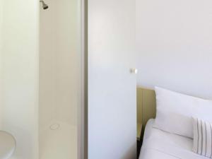 Postel nebo postele na pokoji v ubytování ibis Budget - Newcastle