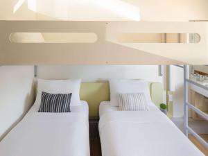 Postel nebo postele na pokoji v ubytování ibis Budget - Newcastle