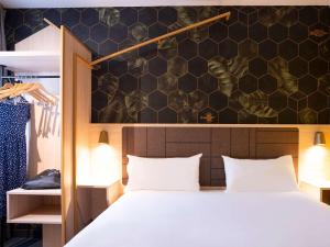Postel nebo postele na pokoji v ubytování ibis Styles Strasbourg Nord Palais des Congrès