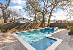 a swimming pool in a backyard with a fence at Time Flys - 498 Baisden Lane in Mallory Park