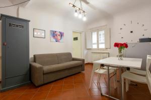 a living room with a couch and a table at Il Vagello B&B in Florence