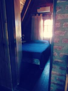 En eller flere senge i et værelse på Complejo Aguador Sur