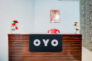 an ovo sign on a counter in a room at Pradhan Hotel in Prayagraj