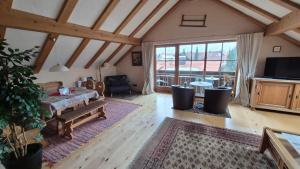 TV a/nebo společenská místnost v ubytování Ferienwohnung Oberstaufenblick