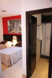 Posteľ alebo postele v izbe v ubytovaní Hostal Central