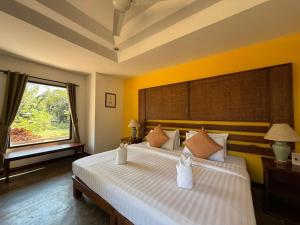 Postel nebo postele na pokoji v ubytování Baan Krating Pai Resort - SHA Plus + 37 fotografií