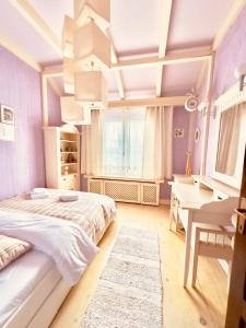 a bedroom with a large bed and a desk at Chalet d'Argent in Dobreni +32 photos