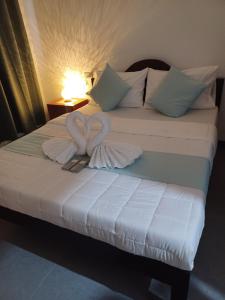 Postel nebo postele na pokoji v ubytování Sebastian Guest House