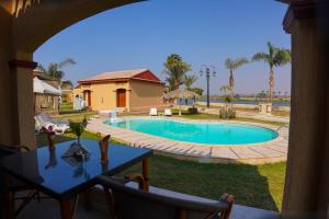a view of a swimming pool in a yard at Grand Aton in Al Ikhşāş