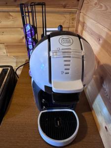 a white and black mixer sitting on a table at Chalet Le refuge in Allos