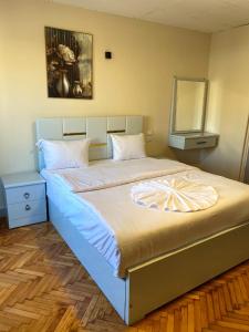 Postel nebo postele na pokoji v ubytování Sky light hotel
