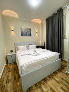 Postel nebo postele na pokoji v ubytování Sky light hotel