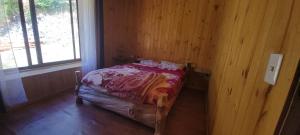 Postel nebo postele na pokoji v ubytování Cabaña Ugarit Chabranco Maihue Futrono