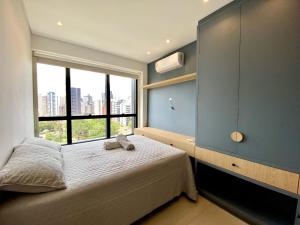 Ένα ή περισσότερα κρεβάτια σε δωμάτιο στο Apartamento Torres RS