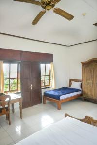 Postel nebo postele na pokoji v ubytování Ubud Backpacker Hostel