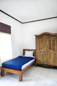 Postel nebo postele na pokoji v ubytování Ubud Backpacker Hostel