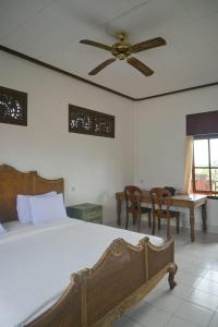 Postel nebo postele na pokoji v ubytování Ubud Backpacker Hostel
