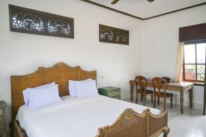Postel nebo postele na pokoji v ubytování Ubud Backpacker Hostel