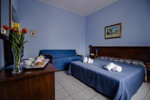 Postel nebo postele na pokoji v ubytování Miramare Hotel