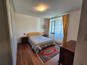 Postel nebo postele na pokoji v ubytování Casa Vacanza Ex Pretura Vallelaghi + 31 fotografií