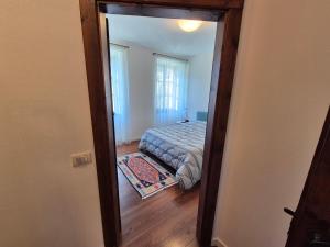 Postel nebo postele na pokoji v ubytování Casa Vacanza Ex Pretura Vallelaghi