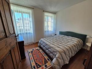 Postel nebo postele na pokoji v ubytování Casa Vacanza Ex Pretura Vallelaghi
